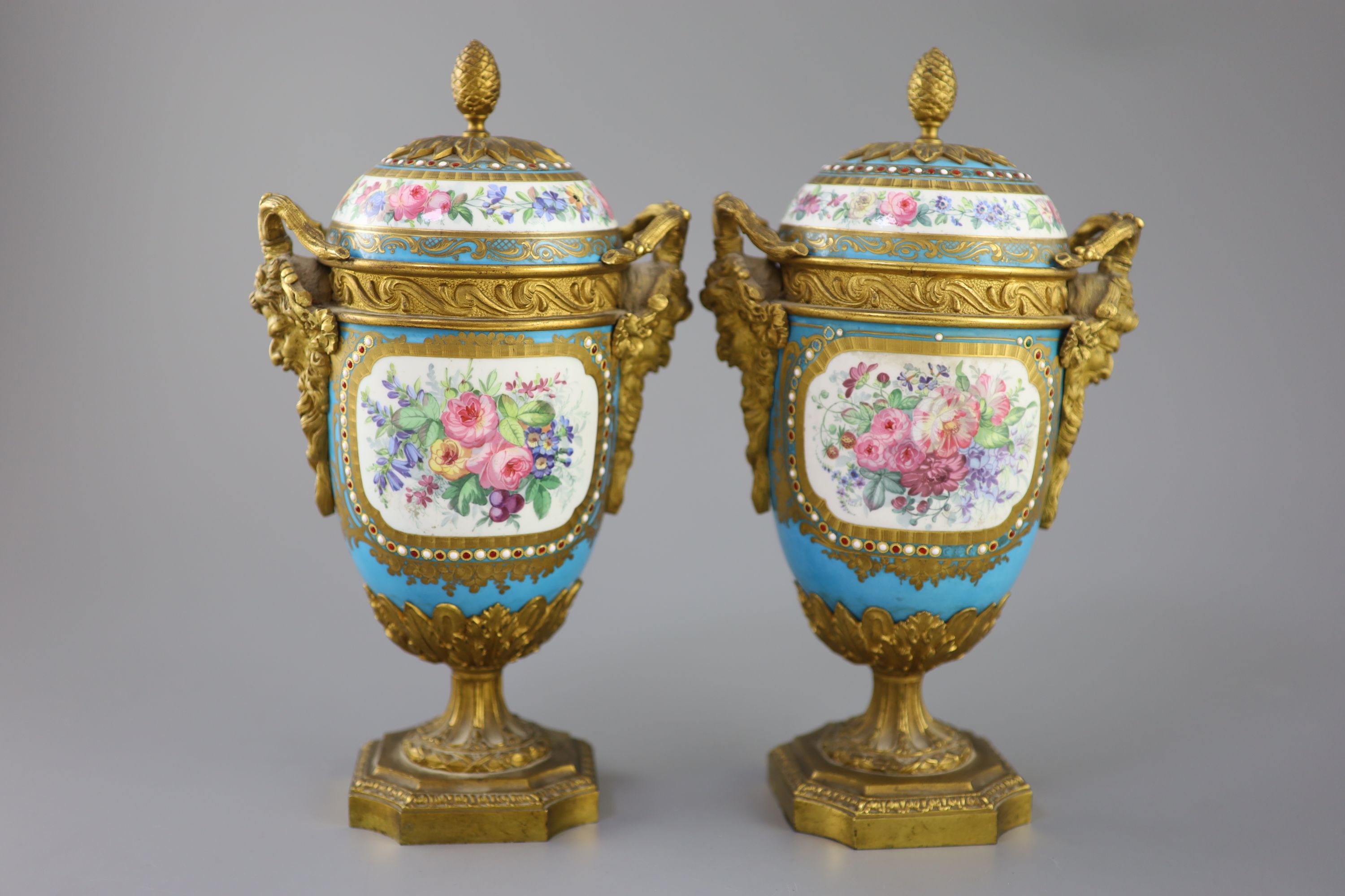 A pair of French Sevres style porcelain and ormolu mounted vases and covers, 19th century, 27cm high